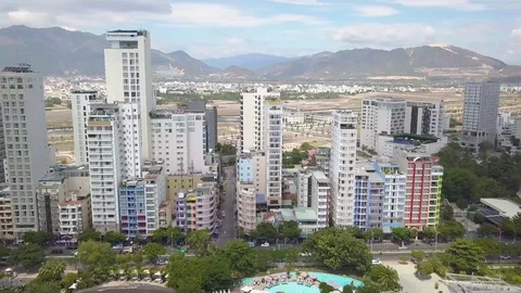Camera flies over the roofs of Nha Trang overlooking the road Stock Footage 119016736