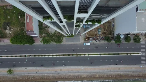 Camera flies over the roofs of Nha Trang overlooking the road Stock Footage 119128759