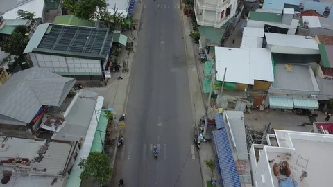Camera flies over the roofs of Nha Trang overlooking the road Stock Footage 119129034