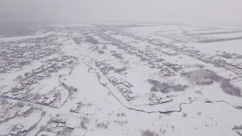 The camera flies over the snow-covered city in Russia Stock Footage 85558043