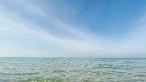 The camera flies over a transparent sea without waves Stock Footage 146522374