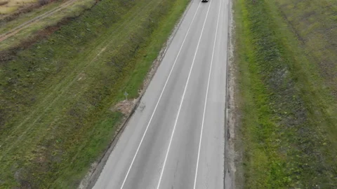The camera flies over the truck effectively driving past the road. Stock Footage 99931786