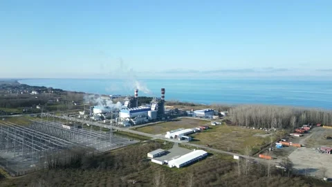 The camera flies in a radius around the power plant on the Black Sea coast. Stock Footage 232919755
