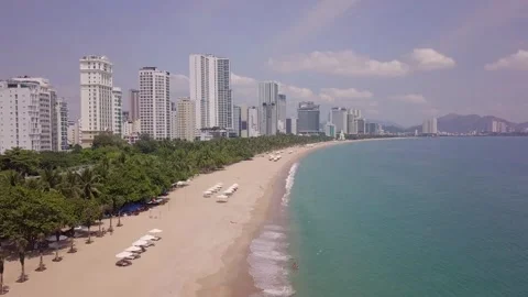 The camera flies slowly over the beach of Nha Trang Stock Footage 275897568