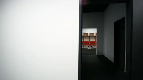 The camera flies through the doorway in front of the sports locker room. 스톡 동영상 171594245
