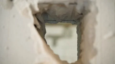 The camera flies through a hole in the wall of aerated concrete bricks Stock Footage 237096615