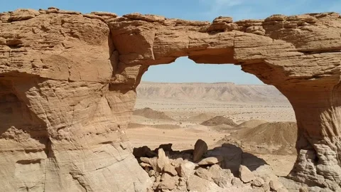 The camera flies through The Natural Arch of Riyadh Stock Footage 153038298