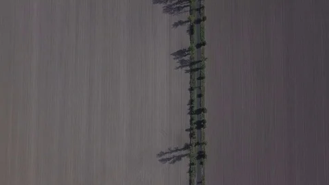 Camera flight above the black field - top down aerial Stock Footage 83800096