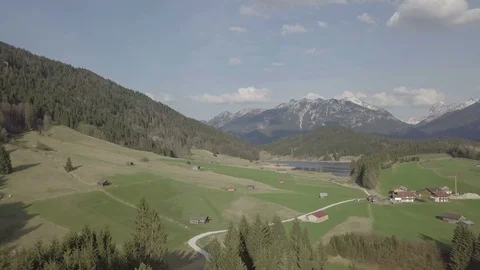 Camera flight above hills in the green mountain landscapes Stock Footage 89756951