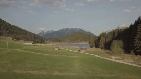 Camera flight above the houses in the mountain landscape Stock Footage 89765290