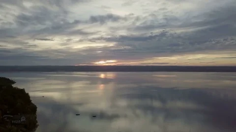 Camera flight above the lake with the colorful sunset - Aerial Stock Footage 83774582