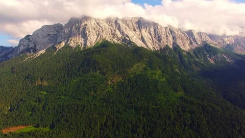 Camera flight over alpine landscape under Zugspitze peak. Stock-Footage 71976693