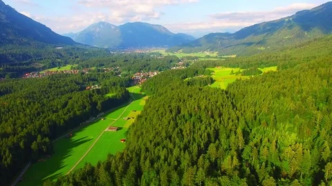 Camera flight over alpine landscape under Zugspitze peak. Stock-Footage 71976710
