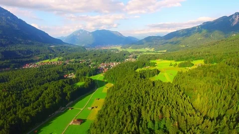 Camera flight over alpine landscape under Zugspitze peak. Stock Footage 71977334