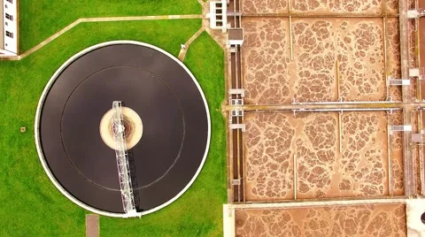 Camera flight over biogas plant from sewage treatment in green fields Stock-Footage 62772326