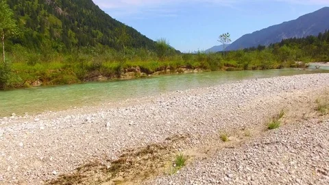 Camera flight over The Isar River in Bavarian Alps. Stock Footage 79711540
