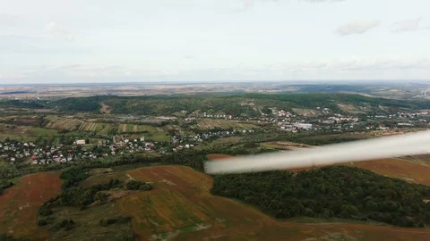 Camera flight over landscape with power plant. Aerial view to wind turbine Stock Footage 130061811