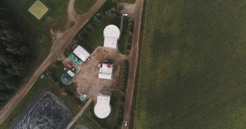 Camera flight over pig farm biogas plant. Renewable energy from biomass. Modern Stock Footage 126645455