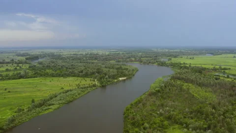 The camera flight over the river in countryside 動画素材 133024583
