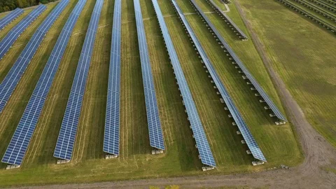 Camera flight over a solar power plant in agricultural landscape. Stock Footage 120122041