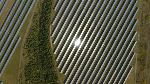 Camera flight over a solar power plant in agricultural landscape. Stock Footage 120122561