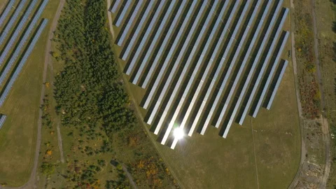 Camera flight over a solar power plant in agricultural landscape. Stock Footage 120123096