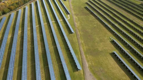 Camera flight over a solar power plant in agricultural landscape. Stock Footage 120123997