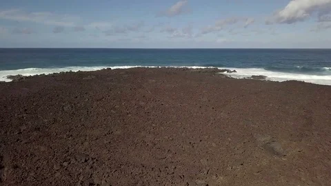 Camera flight toward the horizon with the soft waves on the coast Stock Footage 85058286