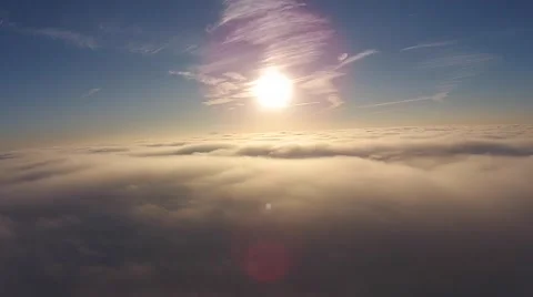 Camera Floating on top of clouds watching the sunrise Stock Footage 43737143