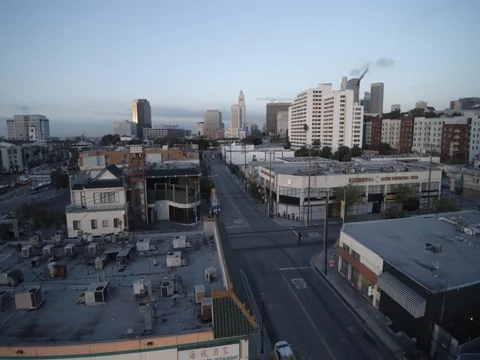 Camera floats forward over morning Chinatown street, with city hall in distance Video stock 76057658