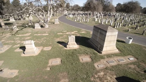 Camera floats left to right over cemetery Stock Footage 100412232