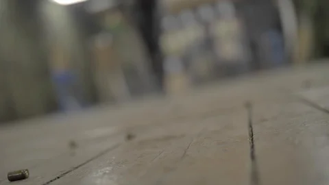 Camera on the floor, first-person view, a girl in black clothes is walking Stock Footage 126373177