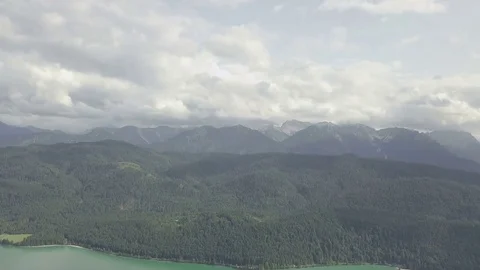 Camera fly above the forest with the mountain on the background Aerial Stock Footage 83761489