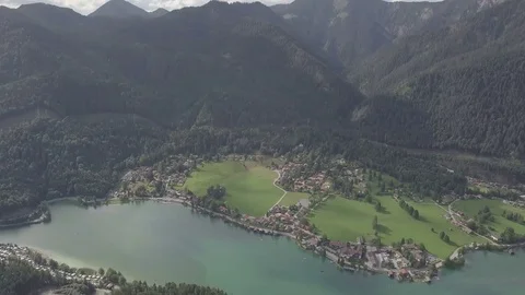 Camera fly above the lake and the small village - Top down Aerial Stock Footage 83764455