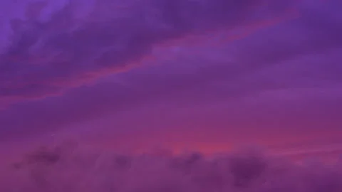 Camera fly into magenta sunset sky with fluffy clouds Stock Footage 148484086