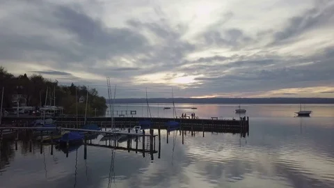Camera fly towards the colorful sunset on the lake - Aerial Stock Footage 83771295