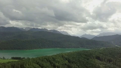 Camera fly towards the lake between the freen hills - Aerial Stock Footage 83760436