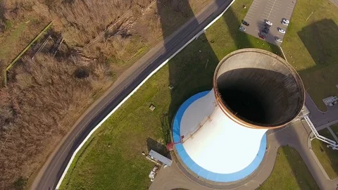 Camera flying above the chimney of the heat power plant. 4K Stock Footage 72333003