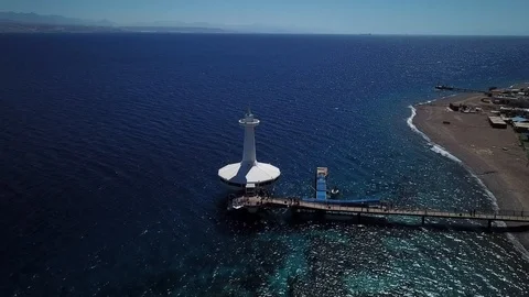 Camera flying along Red Sea beach in Eilat Stock Footage 87912514