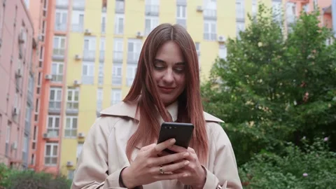 Camera is flying around. Portrait, young, internet, cellphone, street, beautiful Video stock 172414118