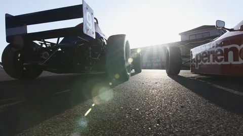 CAMERA FLYING FROM BACK OF RACE CAR INTO THE COCKPIT Stock Footage 127404098