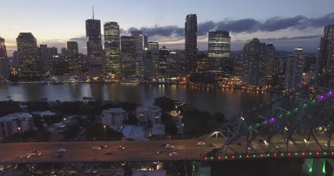 Camera flying backward from  Brisbane and story bridge during the night aerial Stock Footage 102822189