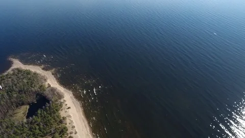 Camera flying over beach and seashore of Gulf of Finland. Aerial drone footage. Stock Footage 76178314
