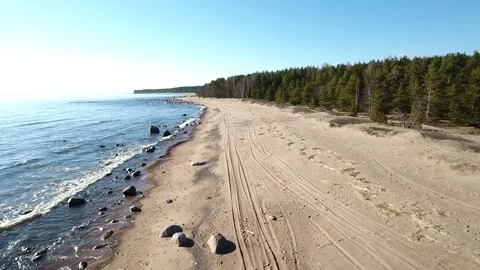 Camera flying over beach and seashore of Gulf of Finland. Aerial drone footage. Stock Footage 76178377