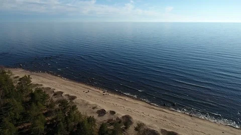 Camera flying over beach and seashore of Gulf of Finland. Aerial drone footage. Stock Footage 76178545