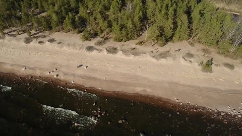 Camera flying over beach and seashore of Gulf of Finland. Aerial drone footage. Stock Footage 76178778