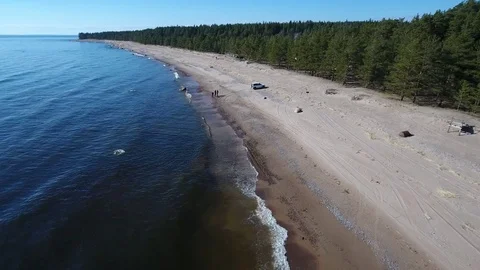 Camera flying over beach and seashore of Gulf of Finland. Aerial drone footage. 库存影片 76179303