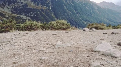 Camera flying over the edge of cliff to the mountain lake view, Stabilized POV. 스톡 동영상 55873263