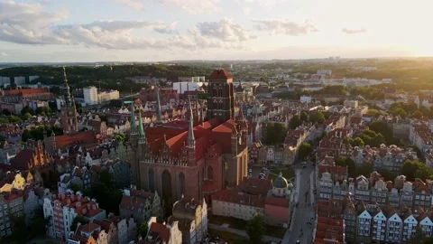 Camera flying over a gothic medieval castle with high spires and a clock Vídeo Stock 203197909