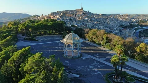 Camera flying over a public garden in Caltagirone Sicily Stock Footage 166643921